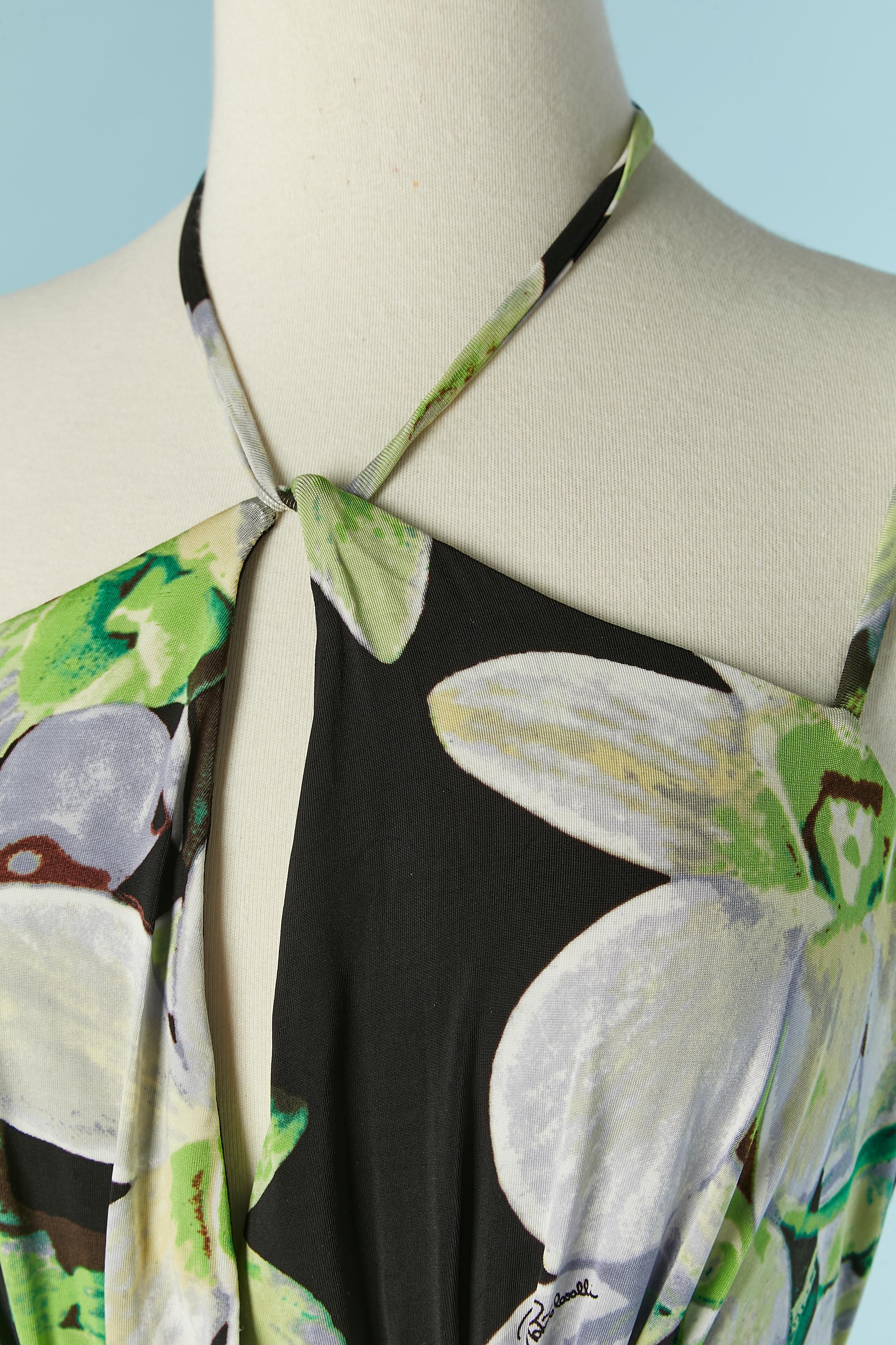 Sleeveless jersey evening jumpsuit with flower print . Fabric composition: 95% rayon, 5% elasthane. Authenticity hologram. Drawstring belt on the waist and tied on the middle back. String tied behind the neck as well. 
SIZE M 
