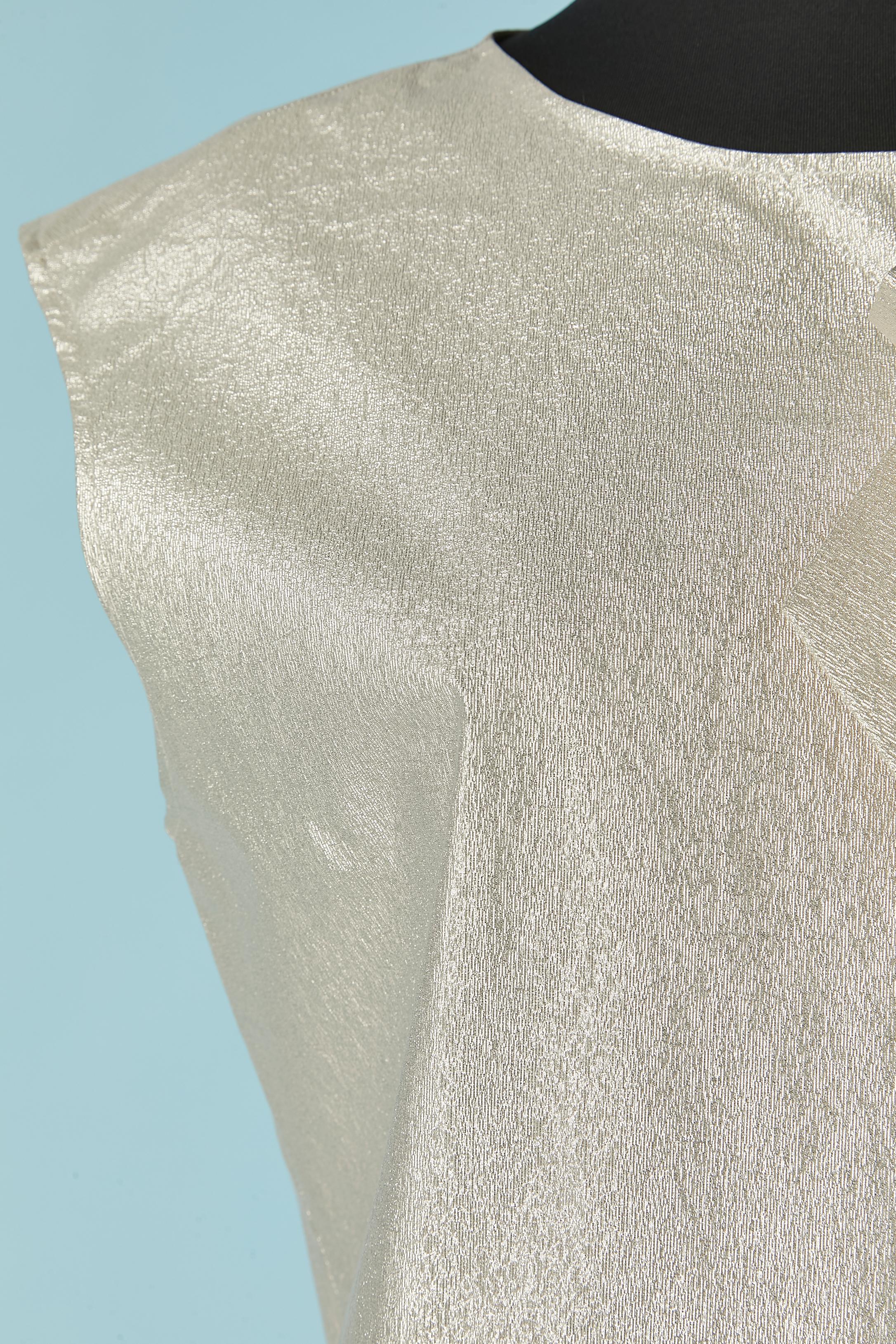 Sleeveless silver lurex cocktail dress with bow. Fabric composition: 48% polyester, 40% nylon, 12% elasthane ( quite crispy, a bit stiff like a paper fabric) 
Zip closure on the middle back. Pocket on both side. 
SIZE 44 (It) 10 (US) L 