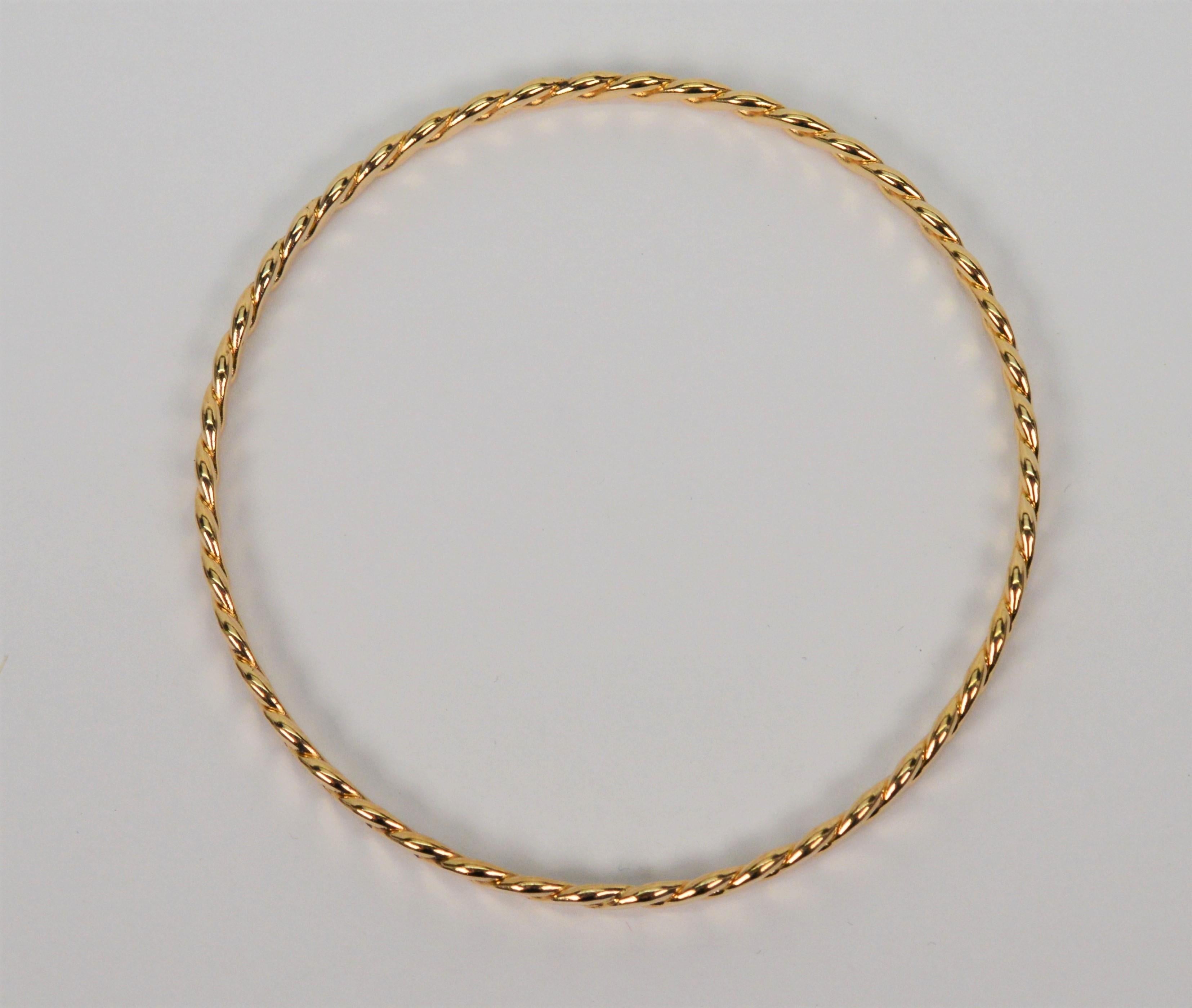 Slender 14 Karat Yellow Gold Twist Bangle Bracelet For Sale 1