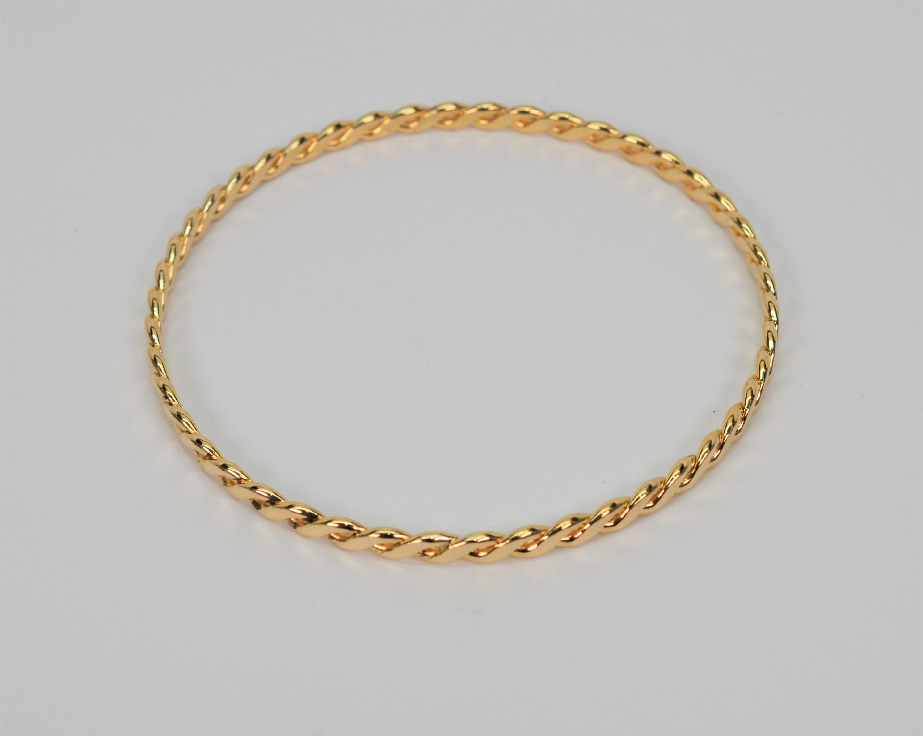 Slender 14 Karat Yellow Gold Twist Bangle Bracelet For Sale 2