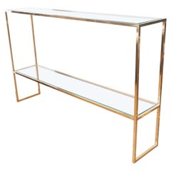Slender brass and glass two shelf console
