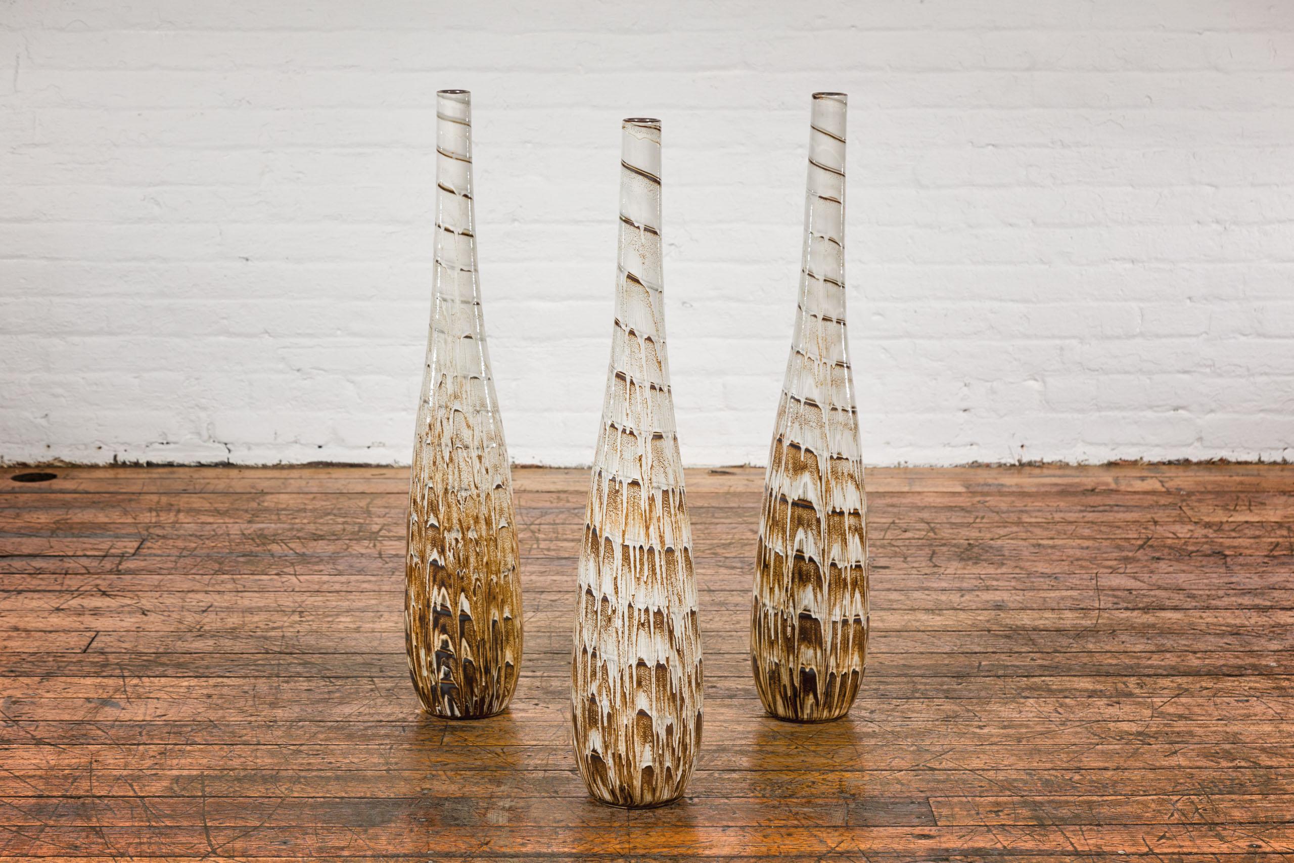 Slender Ceramic Vases with Spiraling Motifs and Brown Drip Glaze, Sold Each In Good Condition For Sale In Yonkers, NY