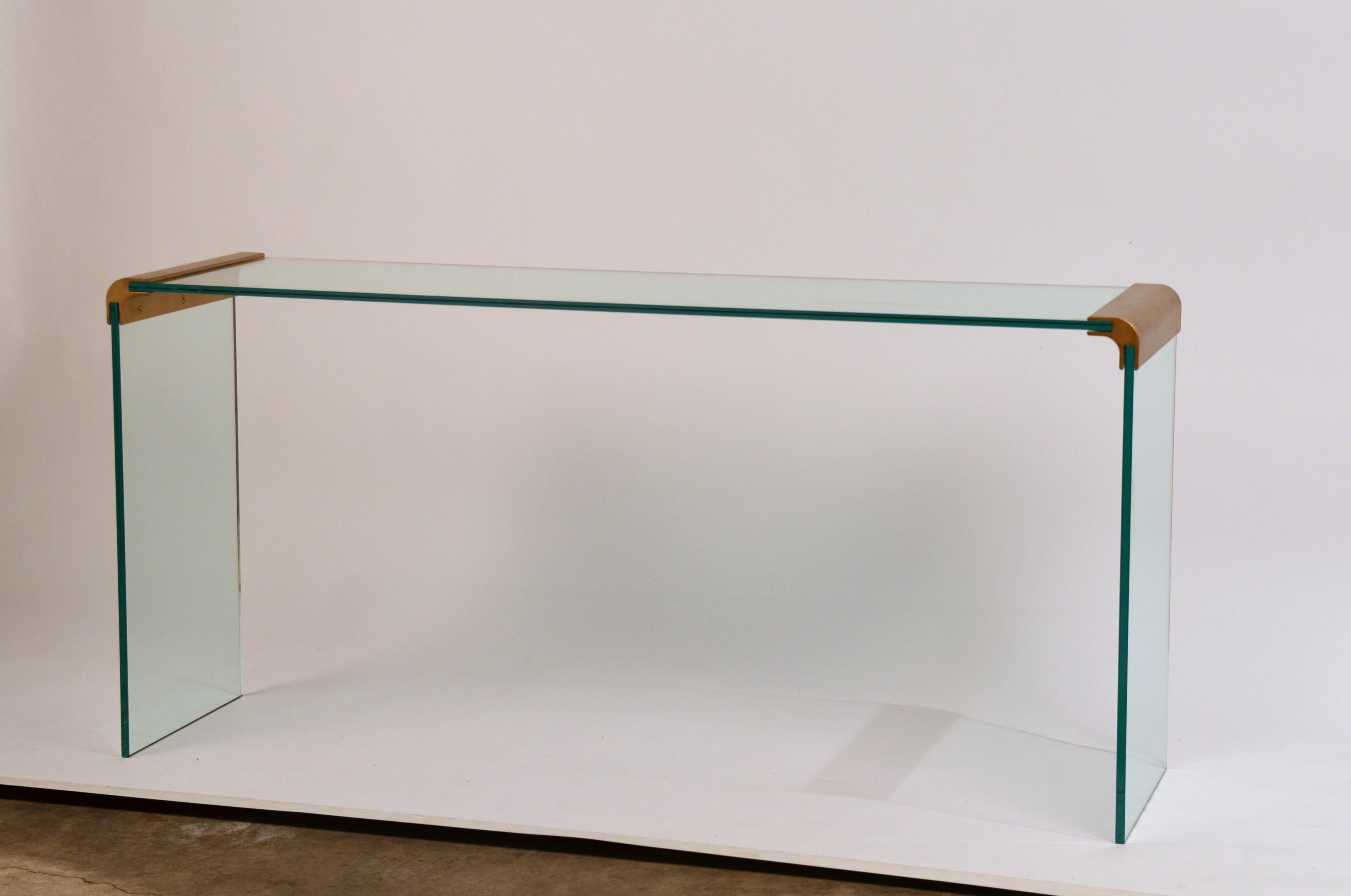 Slender glass and gilt bronze waterfall console by Leon Rosen for Pace collection. Beautiful minimal design.

Great as a console or a sofa table.

The Pace collection was a high-end contemporary furniture company in business from 1960-2001. The
