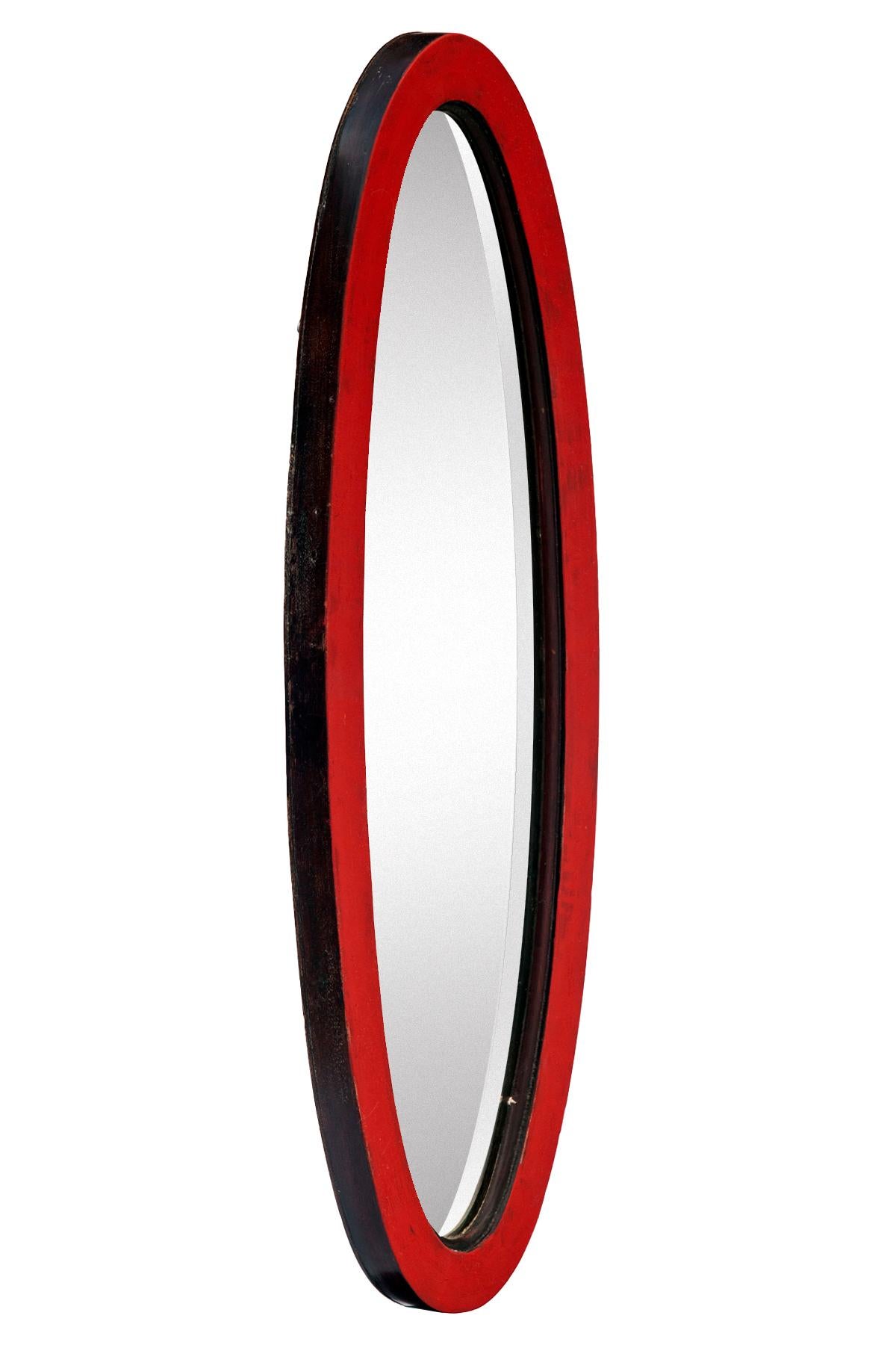 Stunning antique mahogany oval beveled mirror in ruby red & natural mahogany.
Original beveled glass is in pristine condition.
The frame feature a hand painted facade in ruby red & natural mahogany insert & outside edge.
The wood backing