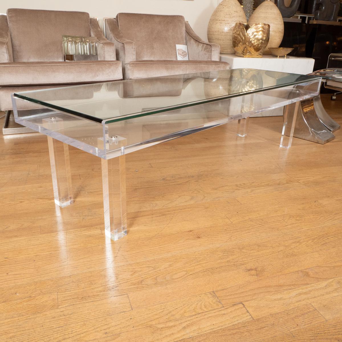 Slender sliding top Lucite and glass coffee table.