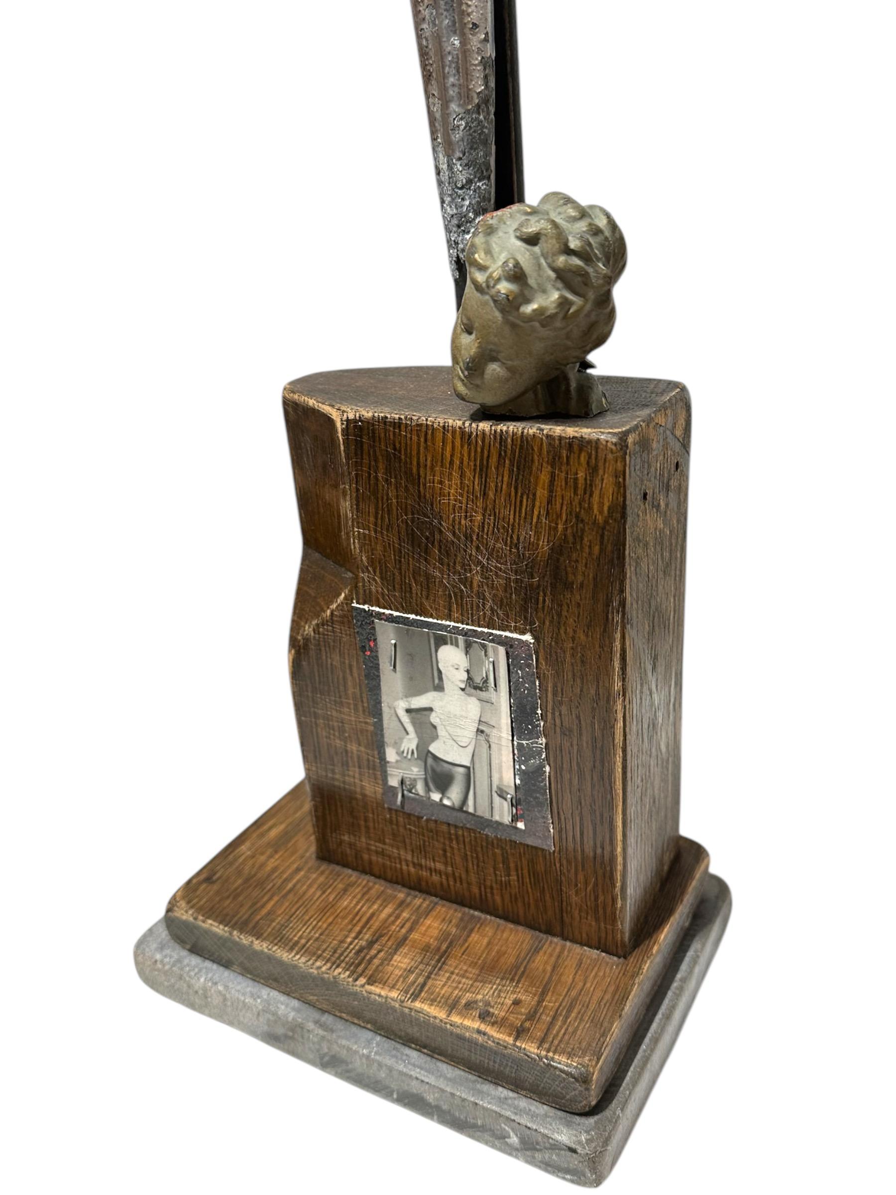 Self-taught artist John Seubert, AKA John Dolly, uses objects he uncovers as he rehabs older homes in Chicago. This piece has a 