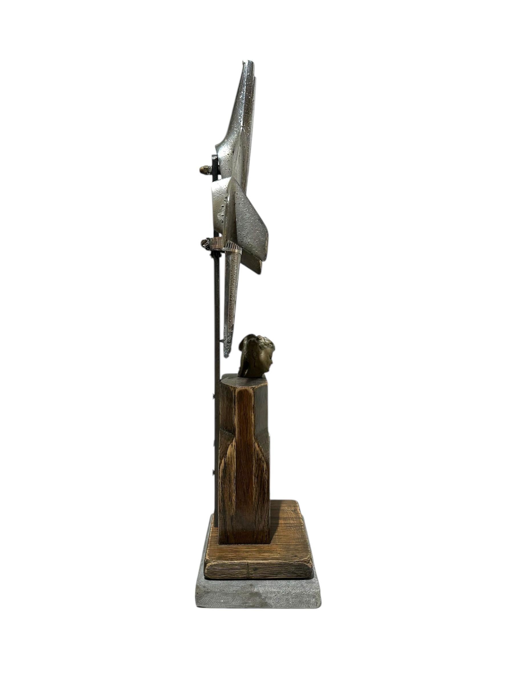 Metal Slice #1, Objet d'Art - Sliced Figurine with Hood Ornament on a Marble Base For Sale
