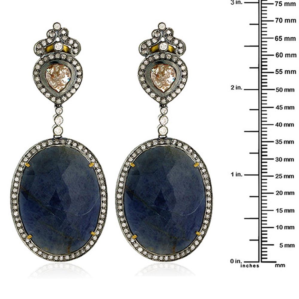 This wonderful looking slice Sapphire Diamond Dangle Earring is evergreen.

Closure: Push Post

18k: 3.71g
Diamond: 6.18ct 
SAPPHIRE: 61.75Cts