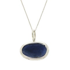 Sliced 8.69 Carat Blue Sapphire 0.24 Carat Diamonds 14 Karat White Gold Necklace