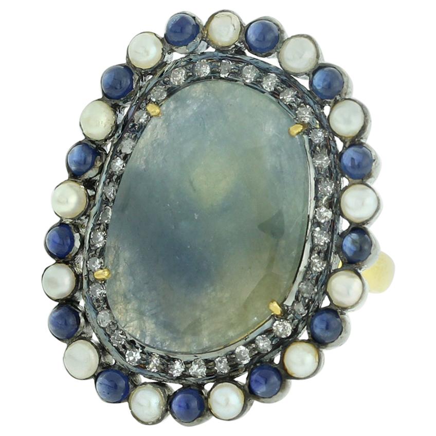 Sliced Blue Sapphire Ring with Diamonds and Pearls For Sale