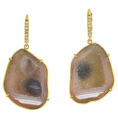 Orecchini a penzoloni in oro giallo 18k con diamanti