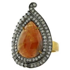 Anillo de Zafiro Naranja y Diamantes en Plata y Oro de 18K