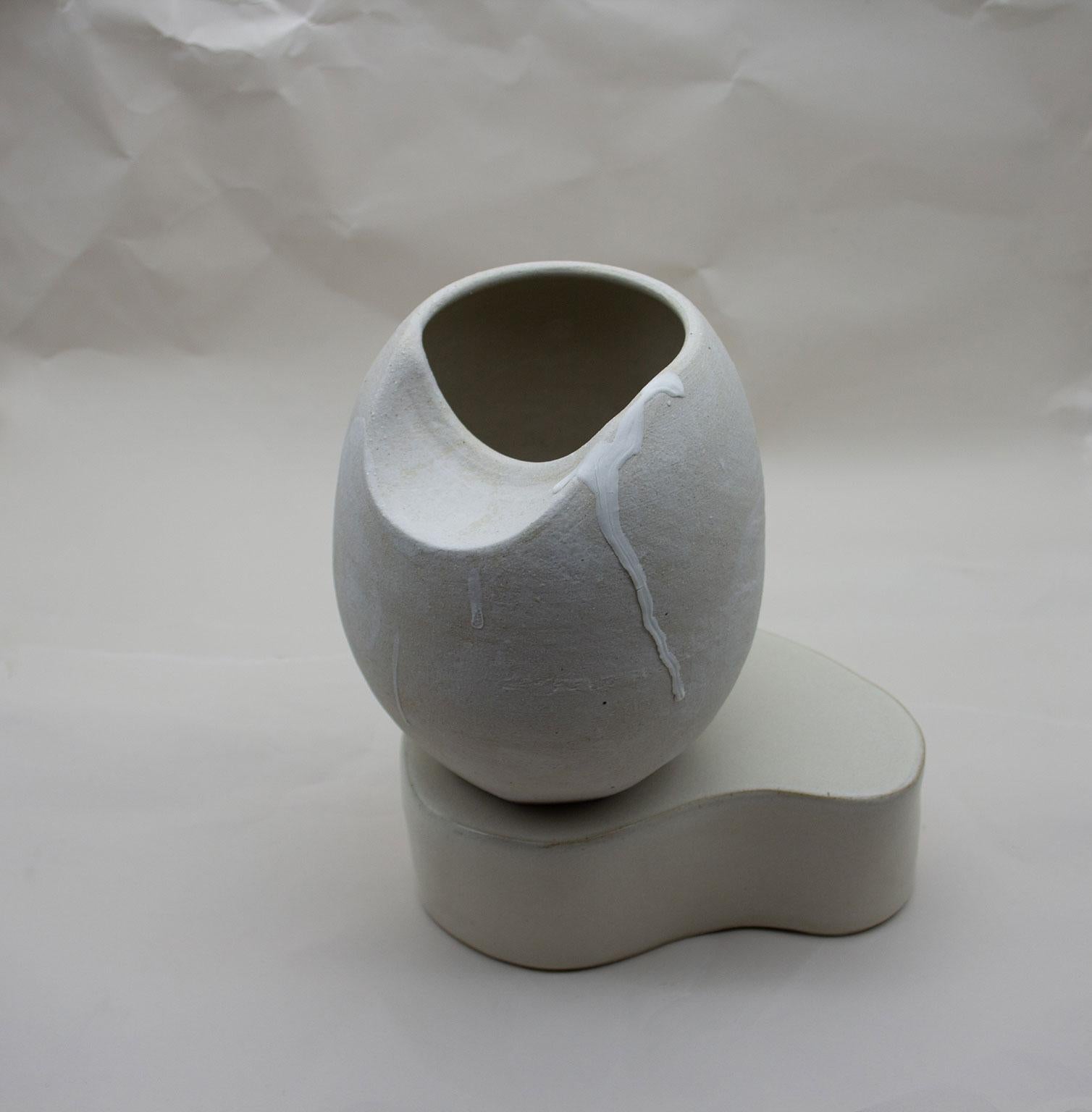 The sliced sphere with plinth blurs the boundary between a functional vase and a sculptural object. Created as part of the Soft, Soft Hard 2018 collection, this piece is an exploration into form and the relationship between the wheel and hand