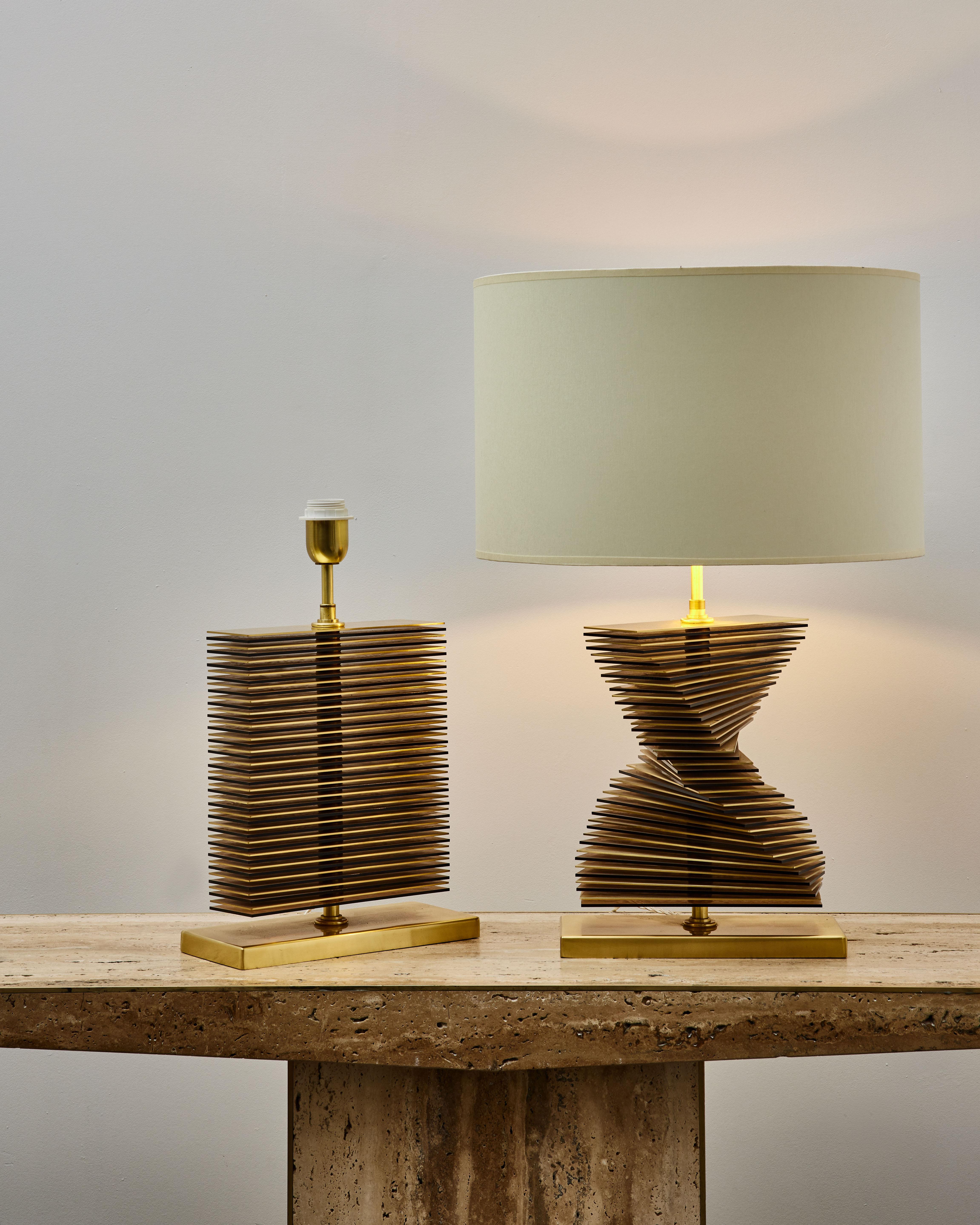 Pair of table lamps with brass and smoked glass slices.
Creation by Studio Glustin

Dimensions: 29 x 12 x H 46 cm (folded)
(Price and dimensions without shade).