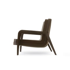 Poltrona Slide Design America in morbido tessuto color cioccolato e struttura color cioccolato.