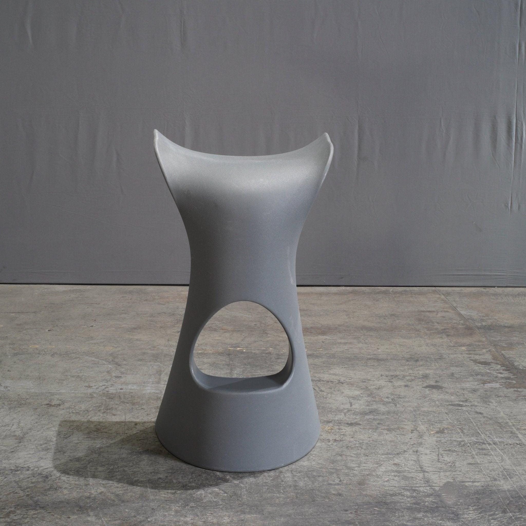 The Slide Koncord Grey Stool by Karim Rashid is a dynamic fusion of futuristic design and ergonomic comfort. Sculpted from durable polyethylene, this stool’s sleek, curvaceous form epitomizes Rashid’s signature aesthetic, blending fluid lines with
