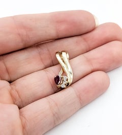 Ciondolo con rubino e diamante in oro giallo 14k