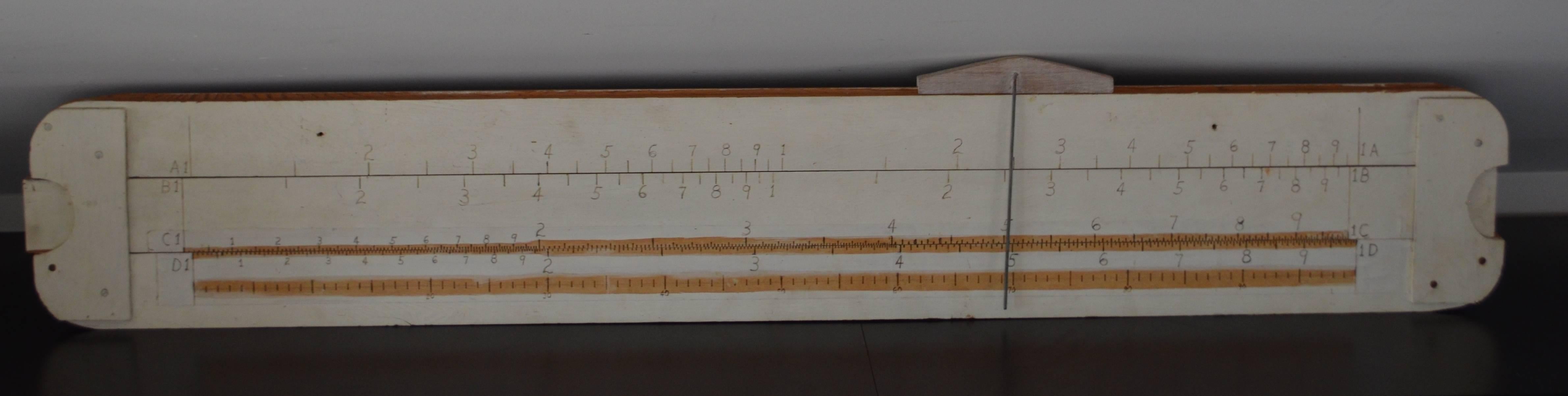 Slide rule handmade oversize for teacher demonstration in the classroom. Back in the day when slide rules were all the rage for mathematical computations, oversize teacher's models were made available for demonstration purposes. These came with a