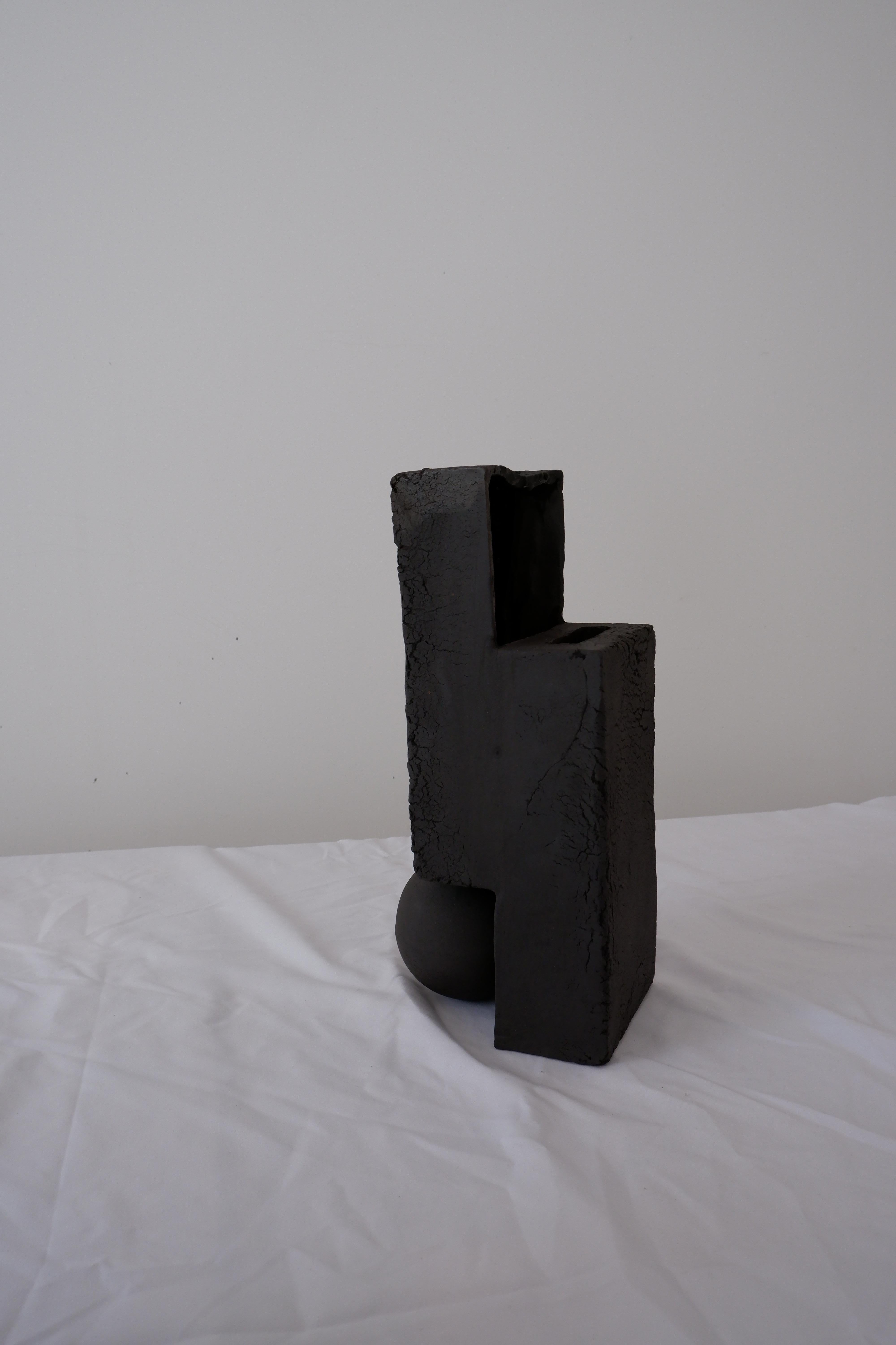 Slide Vase by Ia Kutateladze
One Of A Kind
Dimensions: W 12 x H 32 cm.
Materials: Black clay.

Handbuilt from black clay. Each piece is one of a kind, due to its free hand-building process. Different color variations available: raw black clay, raw