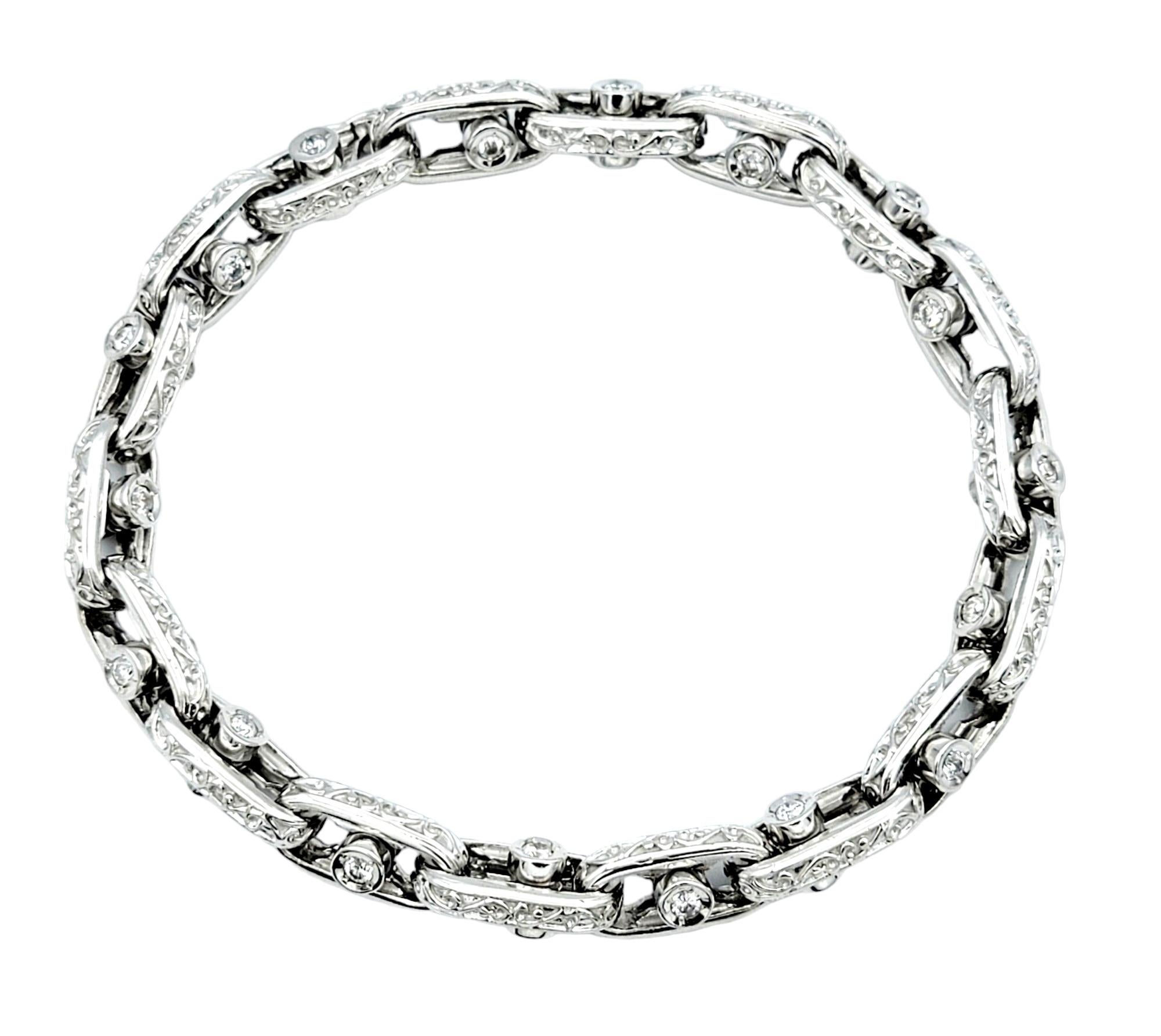 Round Cut Sliding Diamond Oval Link Bracelet with Scroll Design Set in 14 Karat White Gold For Sale