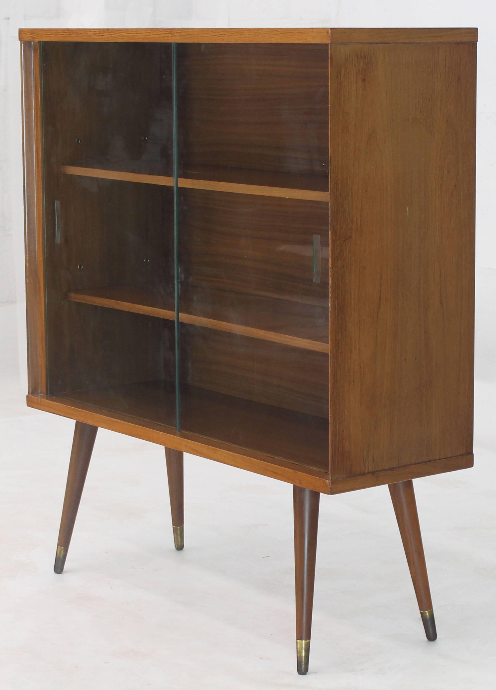 mid century bookcase with glass doors