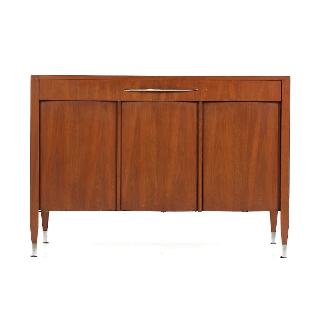 Sligh Mid Century Walnut and Brass Buffet

This buffet measures: 45.75 wide x 19 deep x 32 inches high

All pieces of furniture can be had in what we call restored vintage condition. That means the piece is restored upon purchase so it’s free of