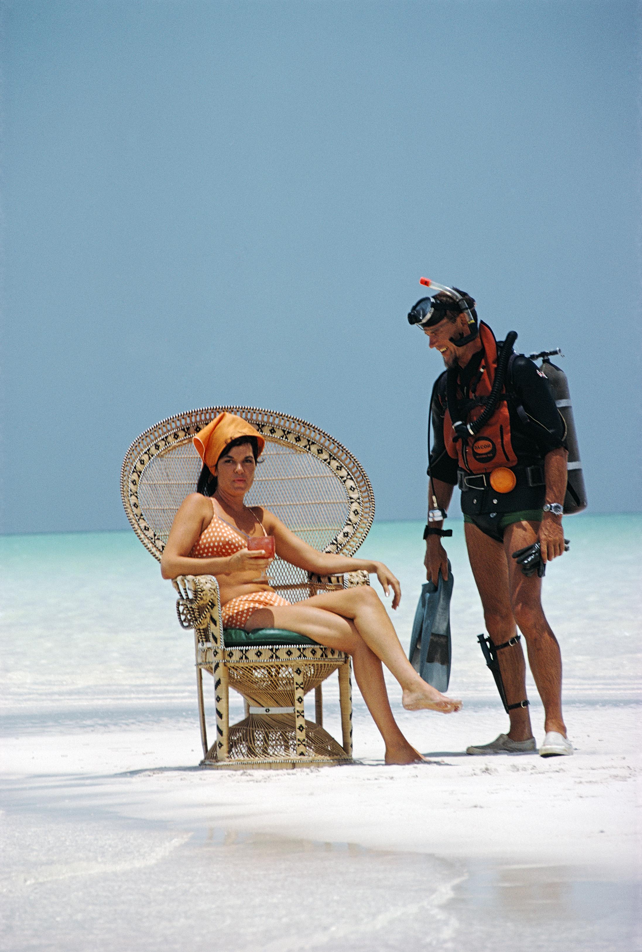 Slim Aarons Color Photograph - A Friendly Chat, Estate Edition, Bahamas