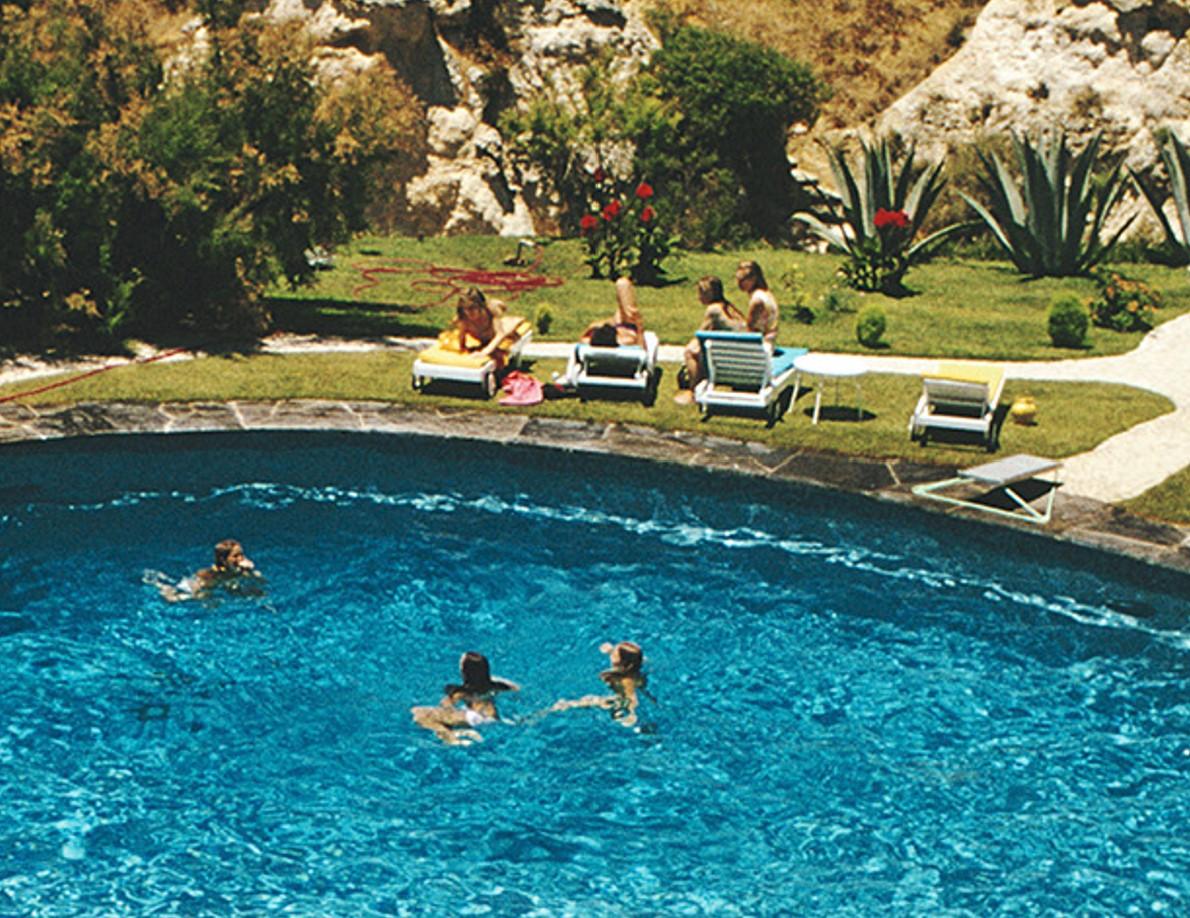 Algarve Hotel Pool, 1970 - Portugal Hotel Swimming Pool Algarve Summer Resort - Black Color Photograph by Slim Aarons