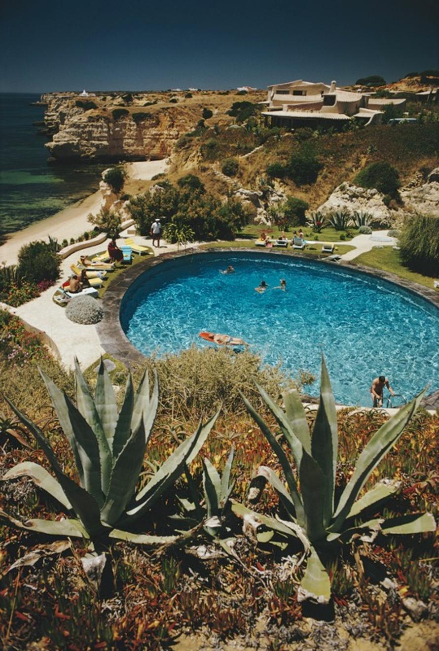 Algarve Hotel Pool 
1970
by Slim Aarons

Slim Aarons Limited Estate Edition

Guests in the pool at the Algarve Hotel, the Algarve, Portugal, 1970.

unframed
c type print
printed 2023
24 x 20"  - paper size

Limited to 150 prints only – regardless of