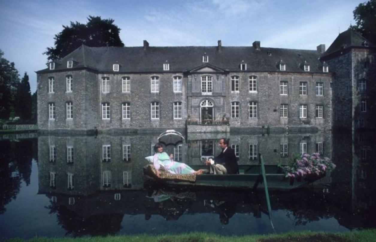 Annevoie 
1980
by Slim Aarons

Slim Aarons Limited Estate Edition

Jean and Christiane de Montpellier d’Annevoie float across the moat of their home, Annevoie, Belgium.

unframed
c type print
printed 2023
20 x 24"  - paper size

Limited to 150