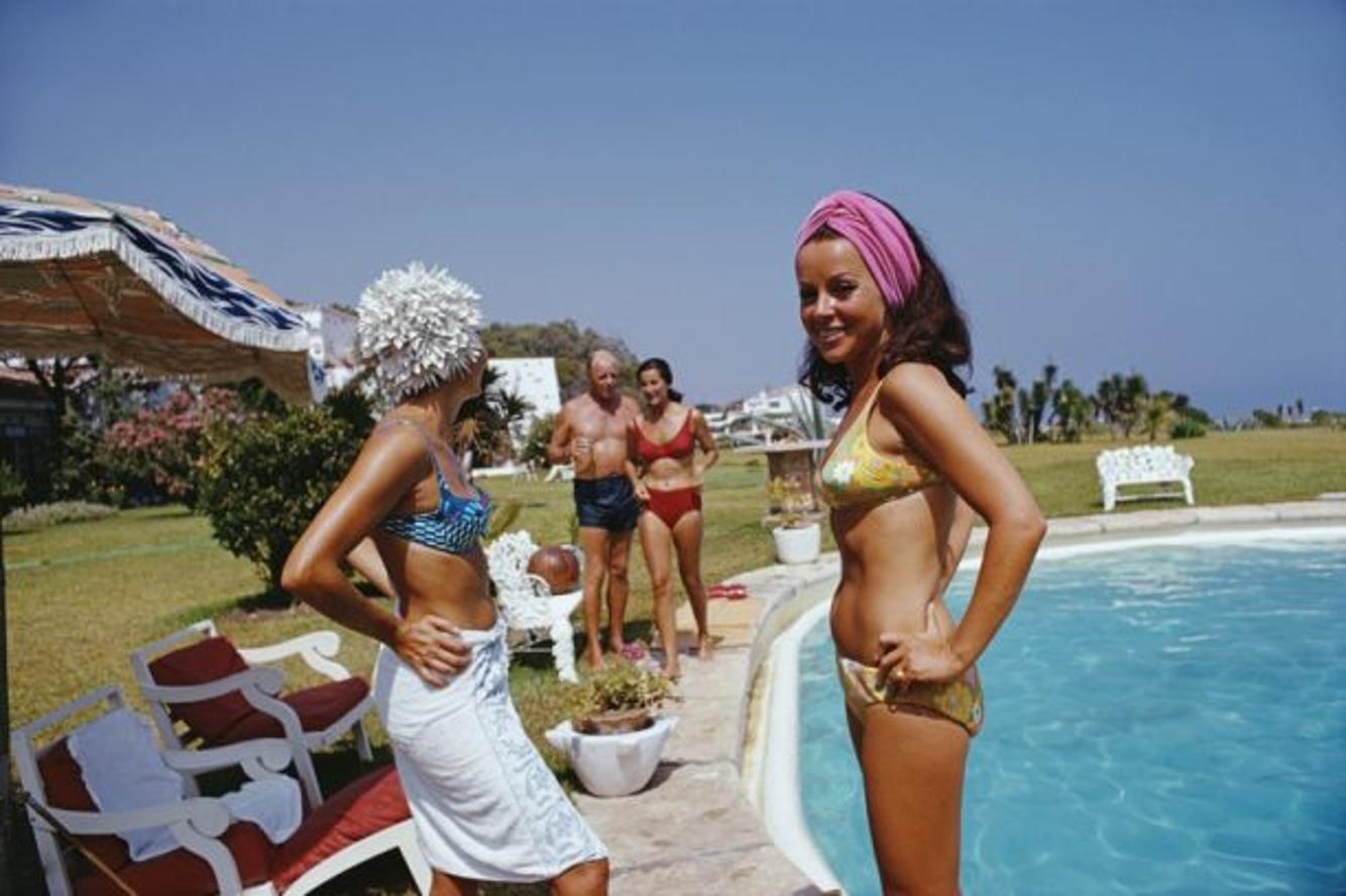 At The Von Pantzs 
1967
by Slim Aarons

Slim Aarons Limited Estate Edition

Bathers by the pool at El Rincon, the Marbella home of Baron and Baroness von Pantz, Spain, August 1967.

unframed
c type print
printed 2023
16×20 inches - paper