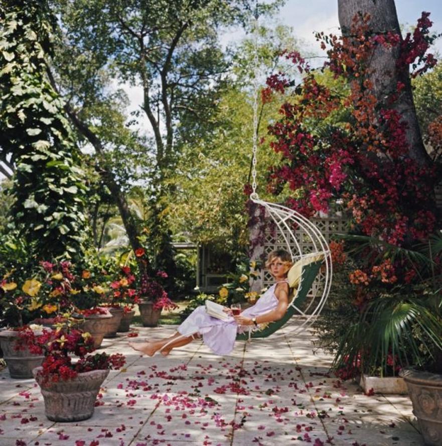 Barbados Bliss 
1976
by Slim Aarons

Slim Aarons Limited Estate Edition

Ava Marshall relaxes with a book amongst the bougainvillea in Barbados, 1976

unframed
c type print
printed 2023
20 x 20"  - paper size


Limited to 150 prints only –
