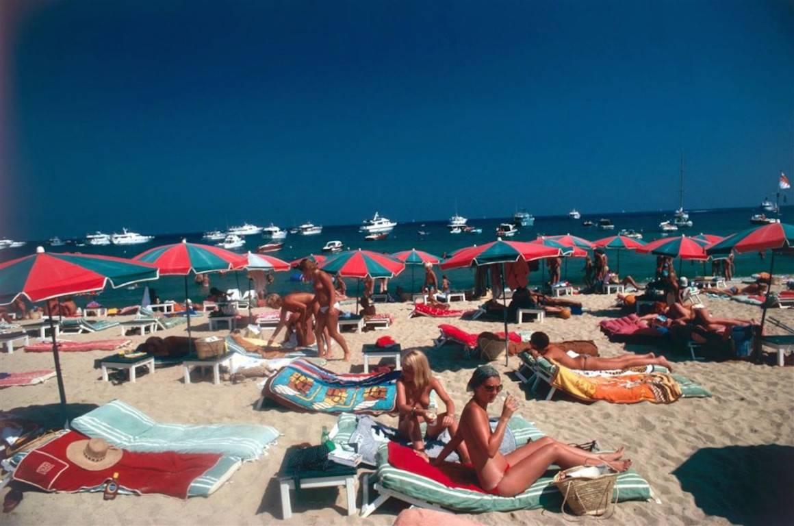 'Beach At St. Tropez' 1977 Slim Aarons Limited Estate Edition

Sunbathers on the beach at St. Tropez, France, 1977.

Produced from the original transparency
Certificate of authenticity supplied 
Archive stamped and numbered in ink on the front