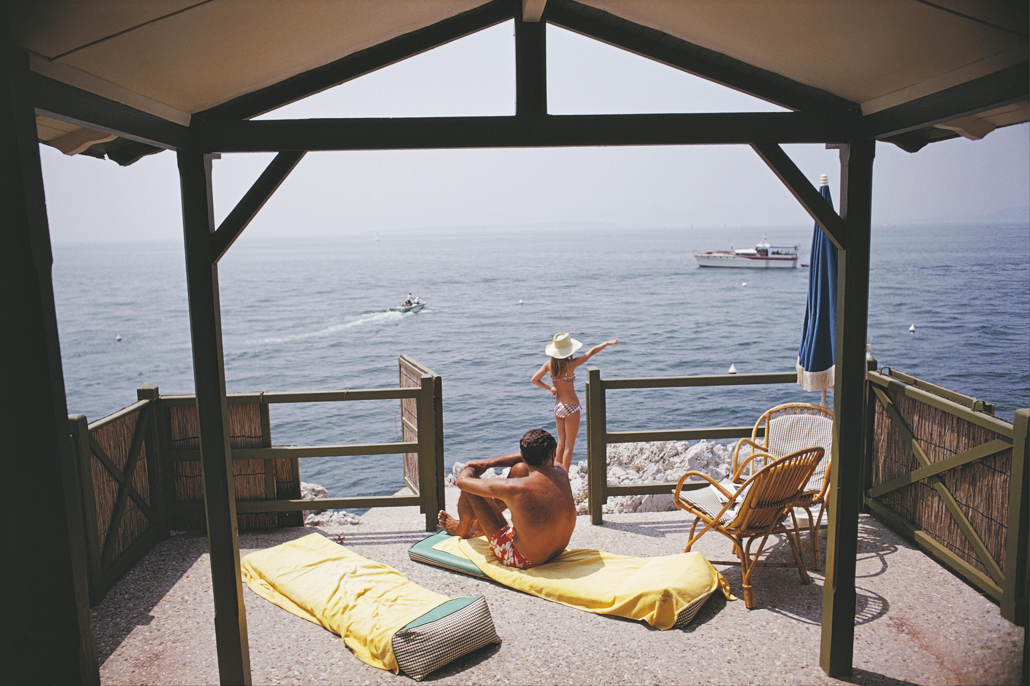 Slim Aarons Figurative Photograph - Beach Hut In Antibes, Estate Edition, Mid-Century Modern Photograph