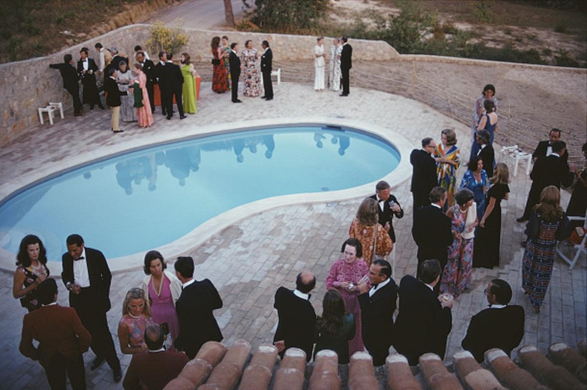 'Black Tie Evening' 1973 Slim Aarons Limited Estate Edition Print 

A formal party by a swimming pool in the Algarve, Portugal, June 1973. 

Produced from the original transparency
Certificate of authenticity supplied 
Archive stamped

Paper Size 