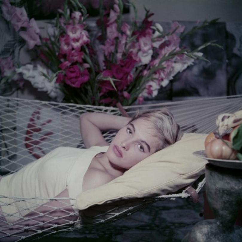 Bond Girl to Be 
1955
by Slim Aarons

Slim Aarons Limited Estate Edition

Sultry sex symbol, film star Ursula Andress takes a siesta in a hammock on a visit to Rome, circa 1955.

unframed
c type print
printed 2023
16×16 inches - paper size


Limited