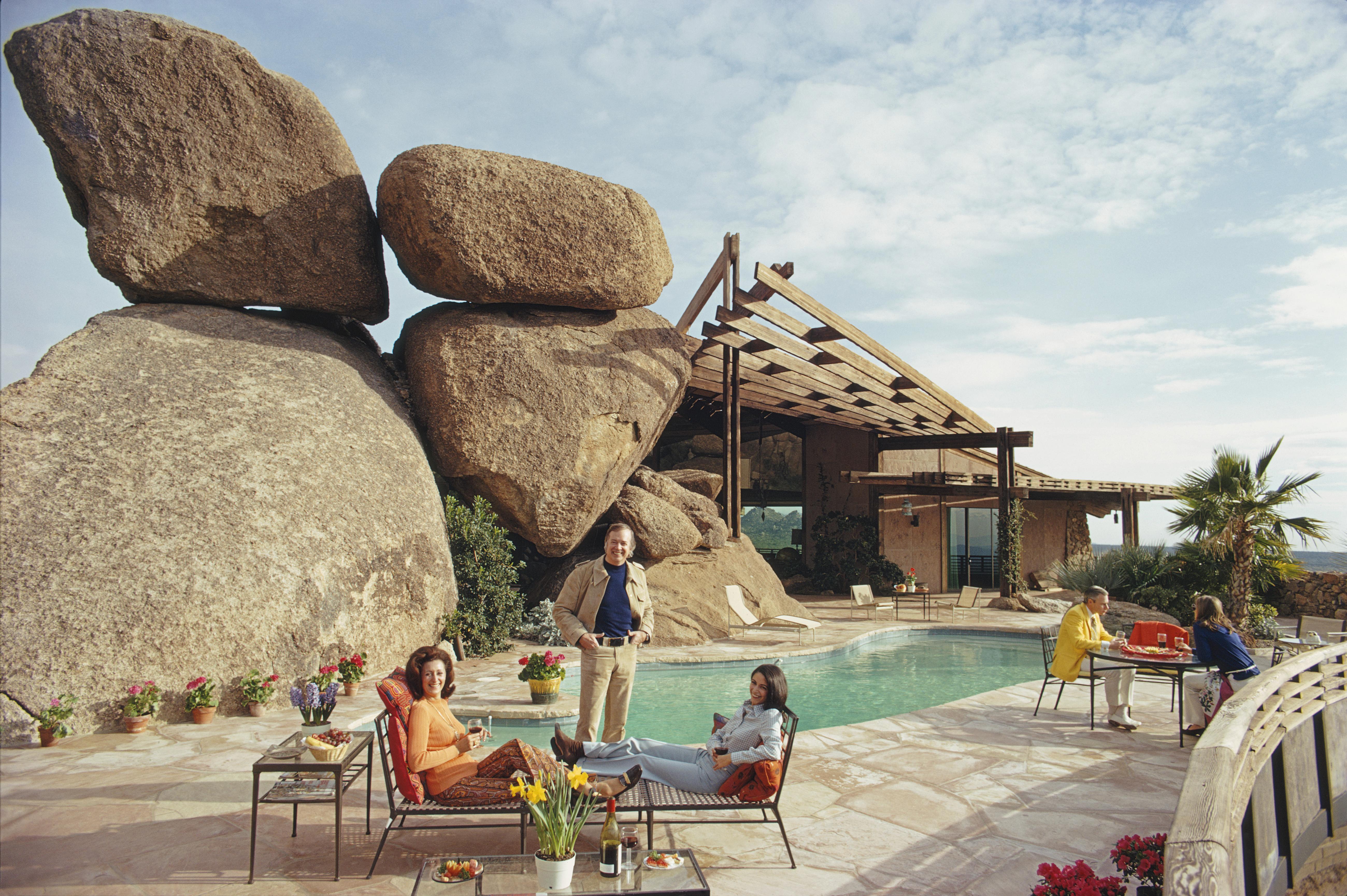 'Bouldereign' 1973 Slim Aarons Limited Estate Edition Print 

Carl Hovgard's home, Bouldereign in Carefree, Arizona, built around the boulders on a desert site, January 1973.

Produced from the original transparency
Certificate of authenticity