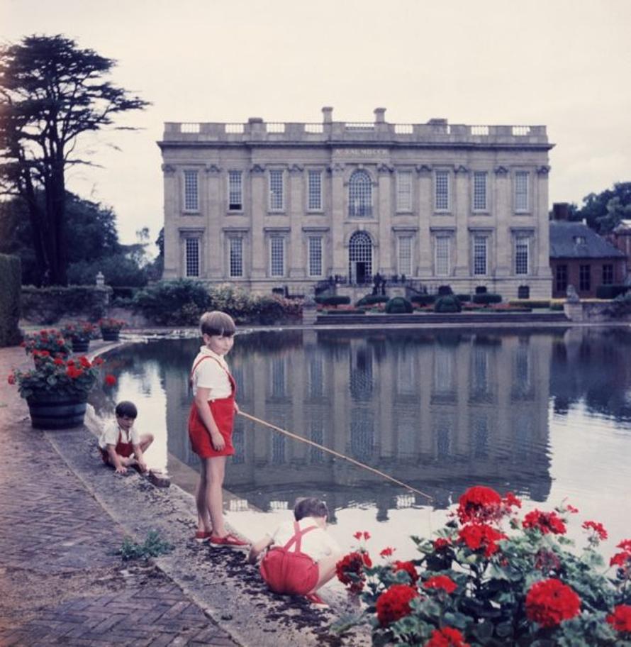 Boy Baron 
1957
by Slim Aarons

Slim Aarons Limited Estate Edition

The youngest peer in England, seven year old Thomas Alexander Fermor-Hesketh, 3rd Baron and 10th Baronet Hesketh, fishing in the lake at his ancestral home Easton Neston House in