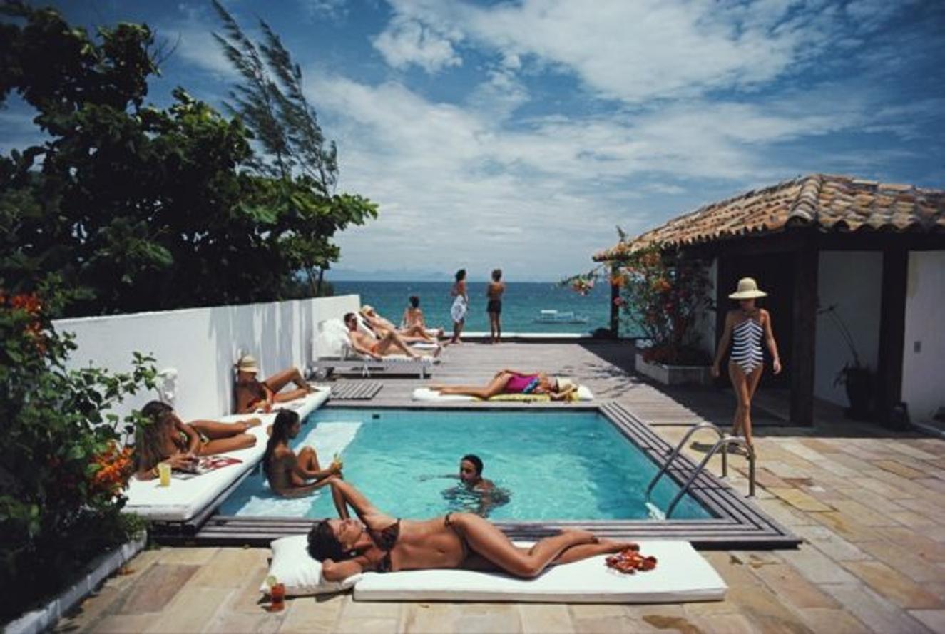 Buzios
1983
by Slim Aarons

Slim Aarons Limited Estate Edition

Holidaymakers in Armacao dos Buzios, Brazil, January 1983. 

unframed
c type print
printed 2023
16×20 inches - paper size


Limited to 150 prints only – regardless of paper size

blind