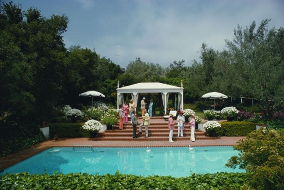 California Garden Party 
1975
by Slim Aarons

Slim Aarons Limited Estate Edition

Guests attend a poolside luncheon at the home of Dorothy Laughlin in Santa Barbara, California, May 1975.

unframed
c type print
printed 2023
16×20 inches - paper