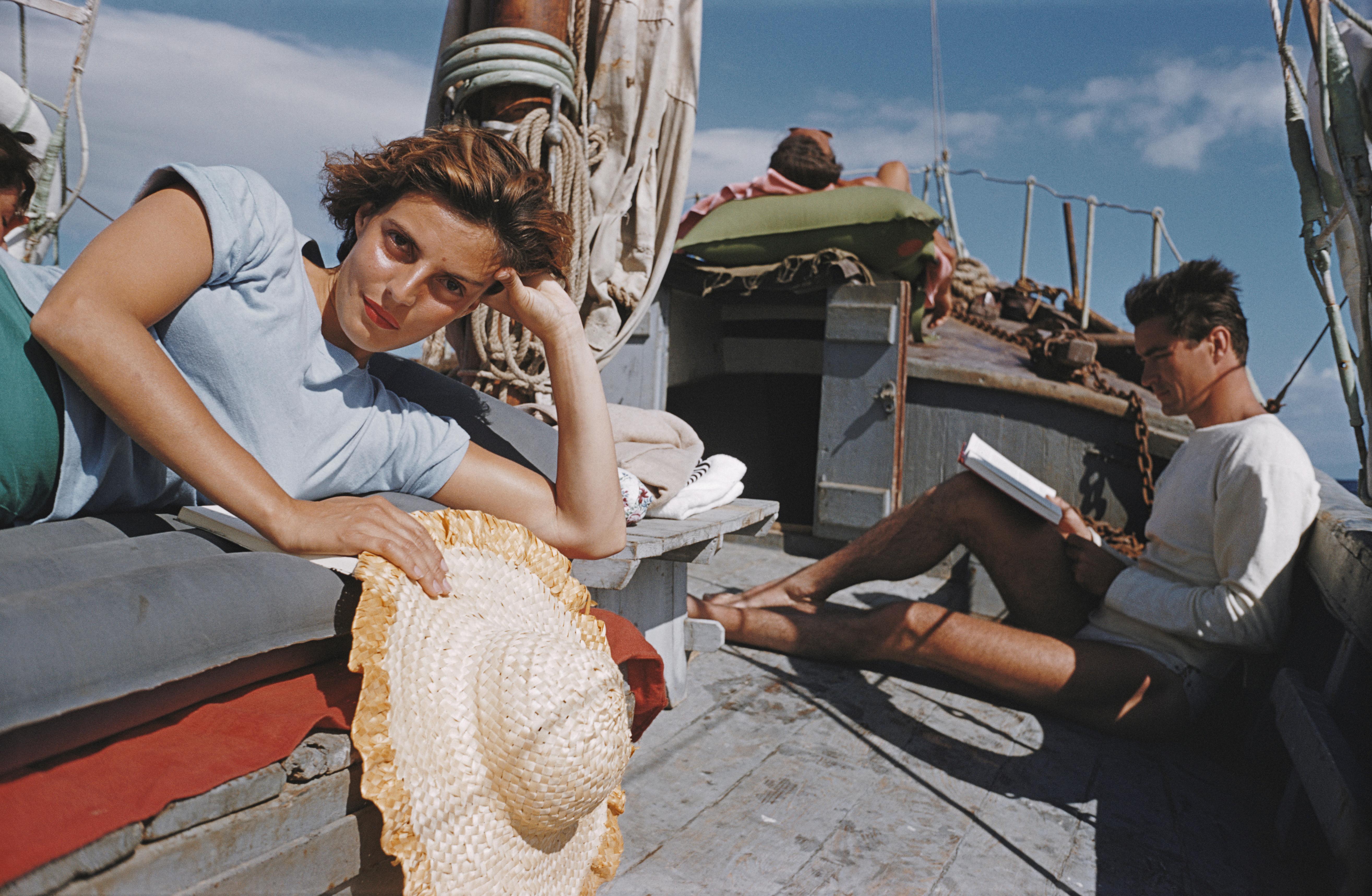 'Capri Cruise' 1958 Slim Aarons Limited Estate Edition Print 

Princess Laudomia Hercolani (in blue) and friends enjoy an on-deck siesta whilst cruising near Capri, July 1958. (Photo by Slim Aarons/Hulton Archive/Getty Images)

Produced from the