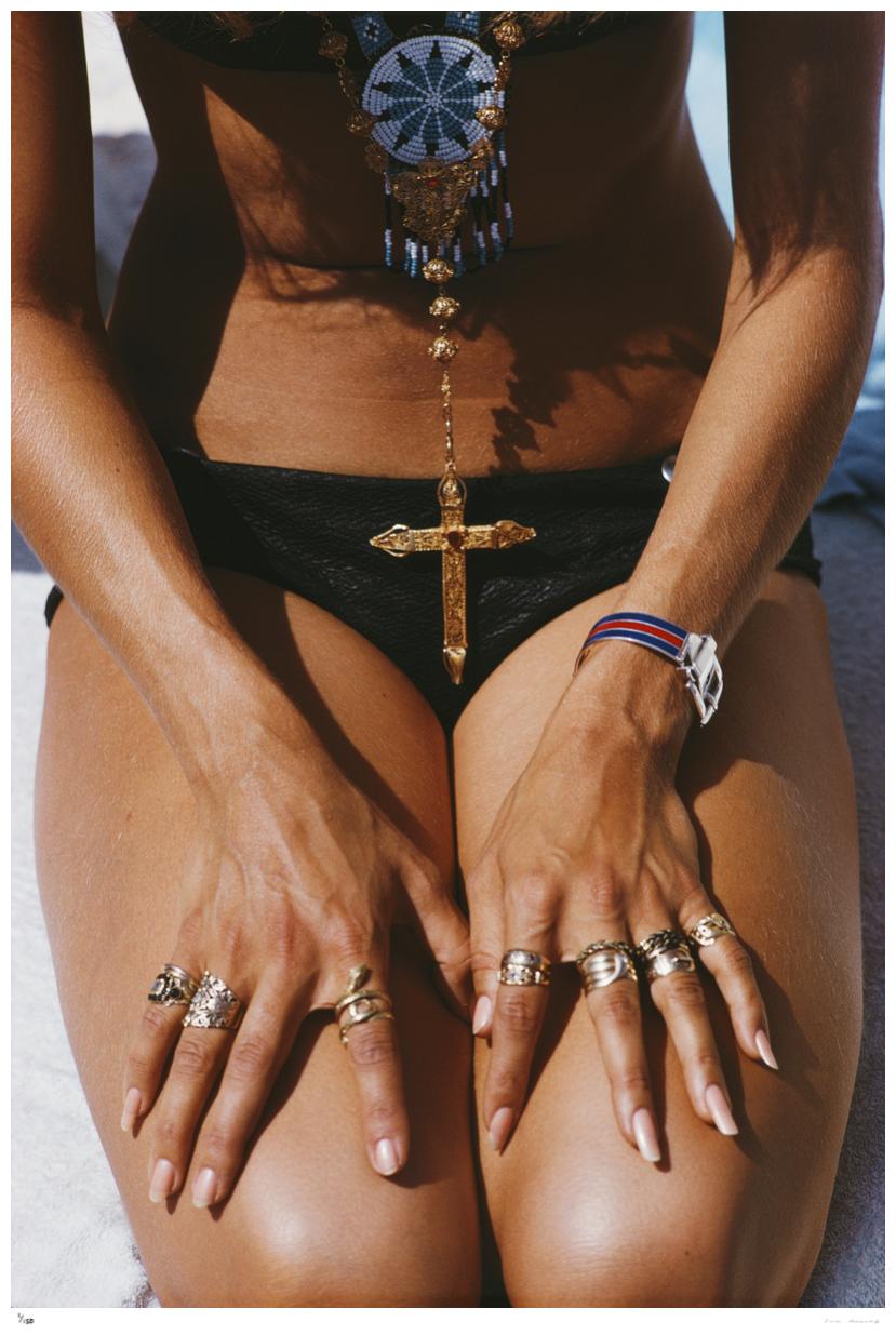 Capri Tan 1968 - Slim Aarons 

1968, A kneeling sunbather shows off her rings and pendant on a beach in Capri, Italy.

40 x 30" inches / 101 x 76 cm paper size 

Photo by Slim Aarons

Printed This Year

Certificate of authenticity included

Unframed