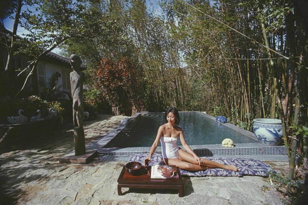 Cecily Godfrey 
1979
by Slim Aarons

Slim Aarons Limited Estate Edition

Cecily Godfrey relaxes by the pool at her home in Hong Kong, 1979. Her husband Gerald is Vice-President of the Court of Appeal in Hong Kong. 

unframed
c type print
printed