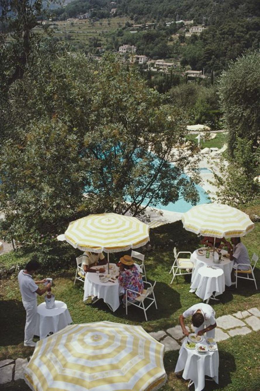 Chateau Saint-Martin 
1986
by Slim Aarons

Slim Aarons Limited Estate Edition

An outdoor luncheon by the swimming pool of the Chateau Saint-Martin, a luxury hotel in Vence on the Cote d’Azur, France, 1986. The building was once a Commanderie of the
