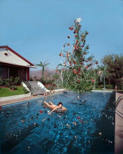Vintage Slim Aarons, Christmas Swim. Rita Aarons swimming in Hollywood California 1954. 