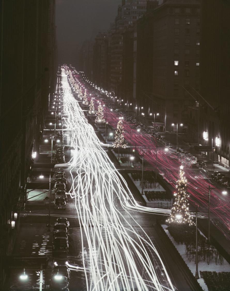 Christmas Traffic 
1953
by Slim Aarons

Slim Aarons Limited Estate Edition

Christmas trees and red and white automobile light trails on Park Avenue, New York, at Christmas time, December 1953

unframed
c type print
printed 2023
24 x 20"  - paper
