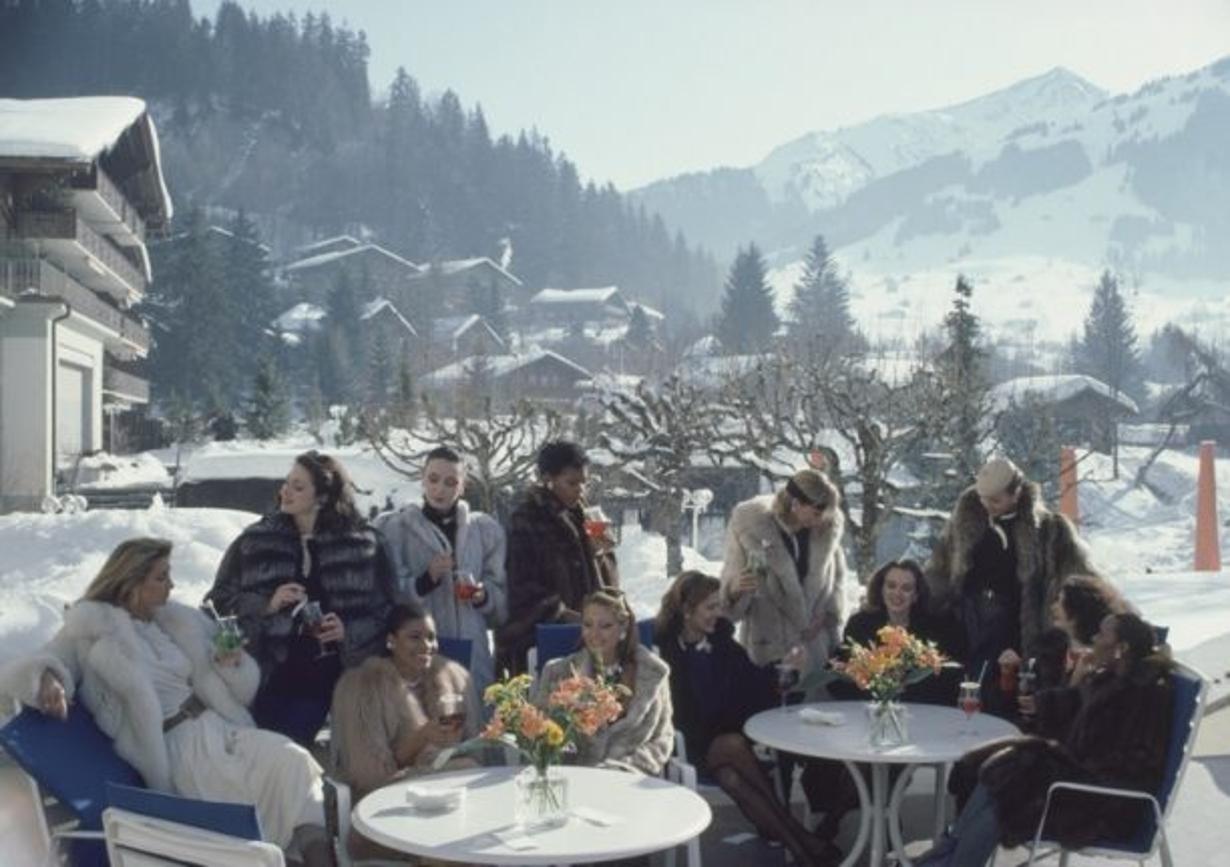 Drinks At Gstaad 
1984
by Slim Aarons

Slim Aarons Limited Estate Edition

Models from Parisian jeweller M. Gerard enjoying drinks on the terrace of The Palace Hotel in Gstaad, Switzerland, 1984

unframed
c type print
printed 2023
20 x 24"  - paper