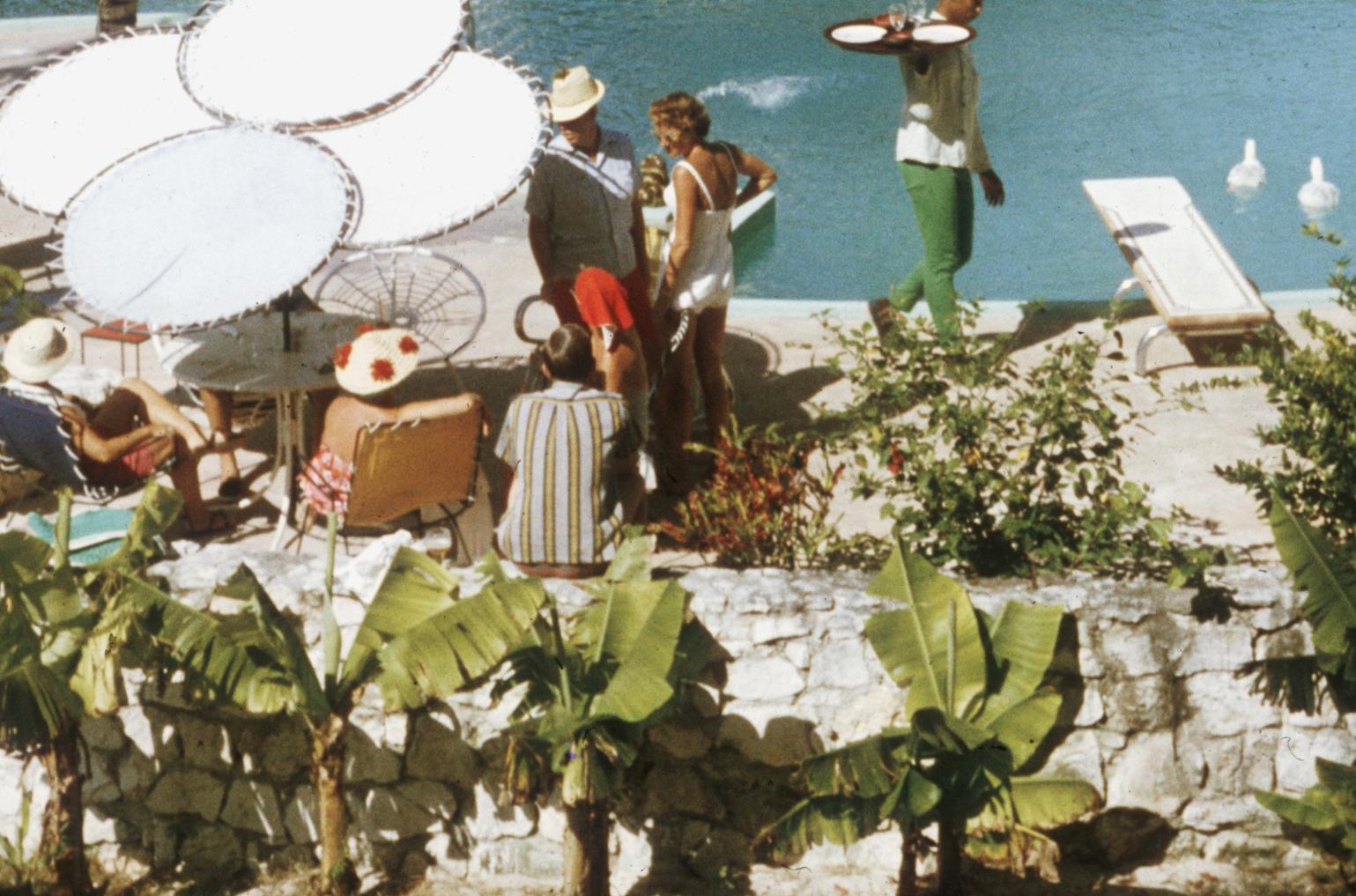 'Eleuthera Pool Party' by Slim Aarons

LIMITED EDITION ESTATE STAMPED PRINT
Numbered in ink to 150 only and emboss stamped on front.

Guests at the French Leave Hotel, owned by actor Craig Kelly, at Eleuthera in The Bahamas, 1960.

This photograph