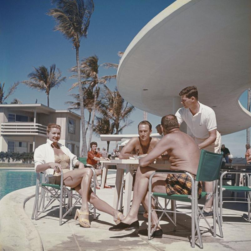 Esther Williams In Florida 
1955
by Slim Aarons

Slim Aarons Limited Estate Edition

American swimmer and actress Esther Williams by the pool with friends in Florida, 1955.

unframed
c type print
printed 2023
16×16 inches - paper size


Limited to