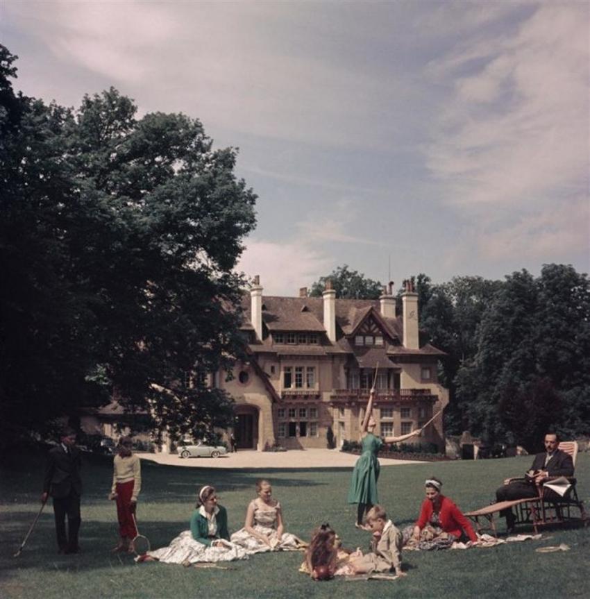 French Stately Home 
1956
by Slim Aarons

Slim Aarons Limited Estate Edition

The Comte de Paris, pretender to the French throne, with his wife the Comtesse and their children at their home, the Manoir du Coeur Volant, Louveciennes, France,